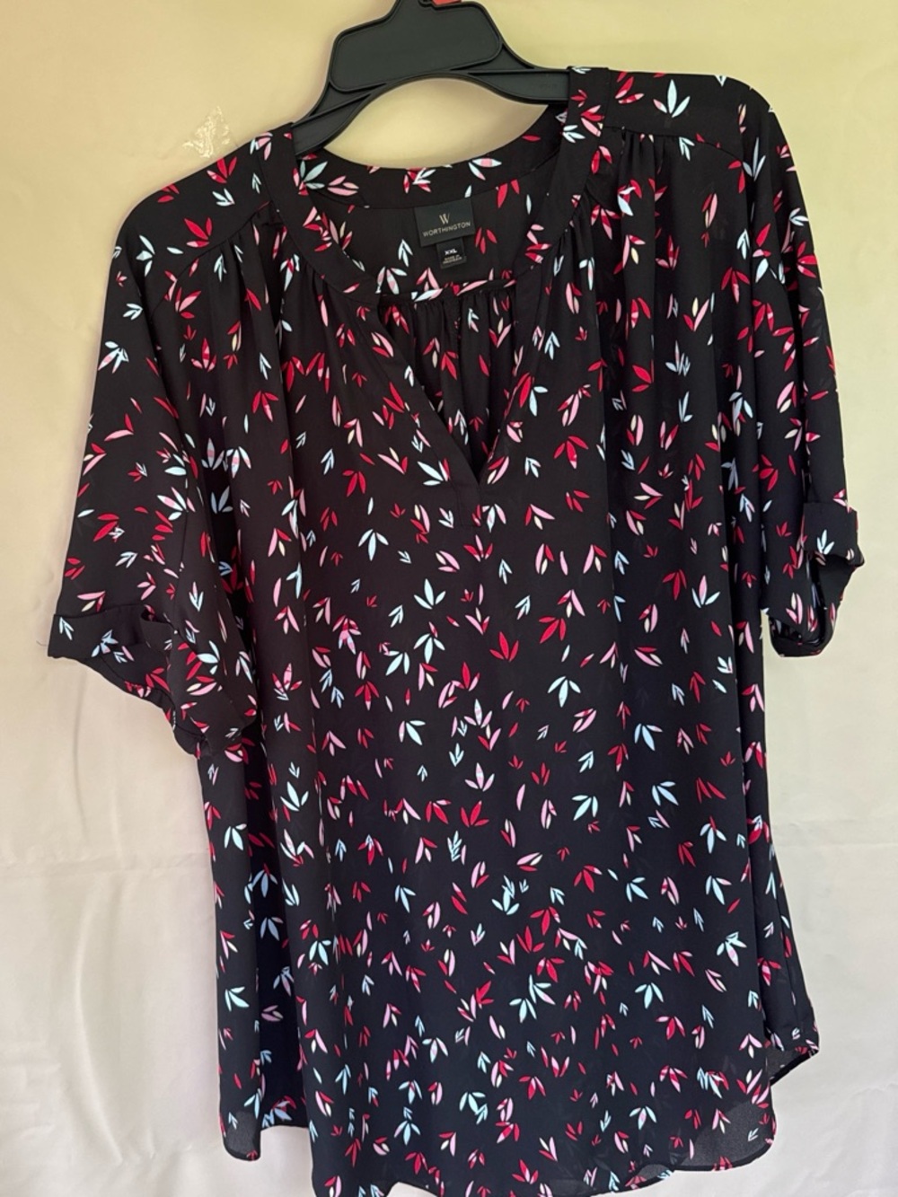 Worthington Black top with red and Light Blue Leaf Print